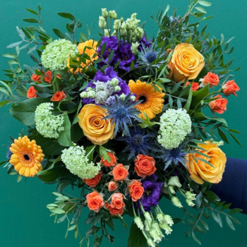 Yellow rose bouquet with blues and pruples available for delivery in Darlington for Valentines